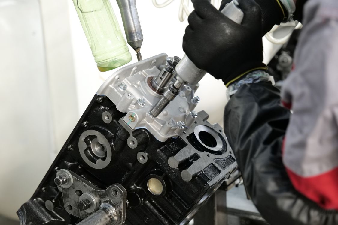 Engine components being assembled with precision tools
